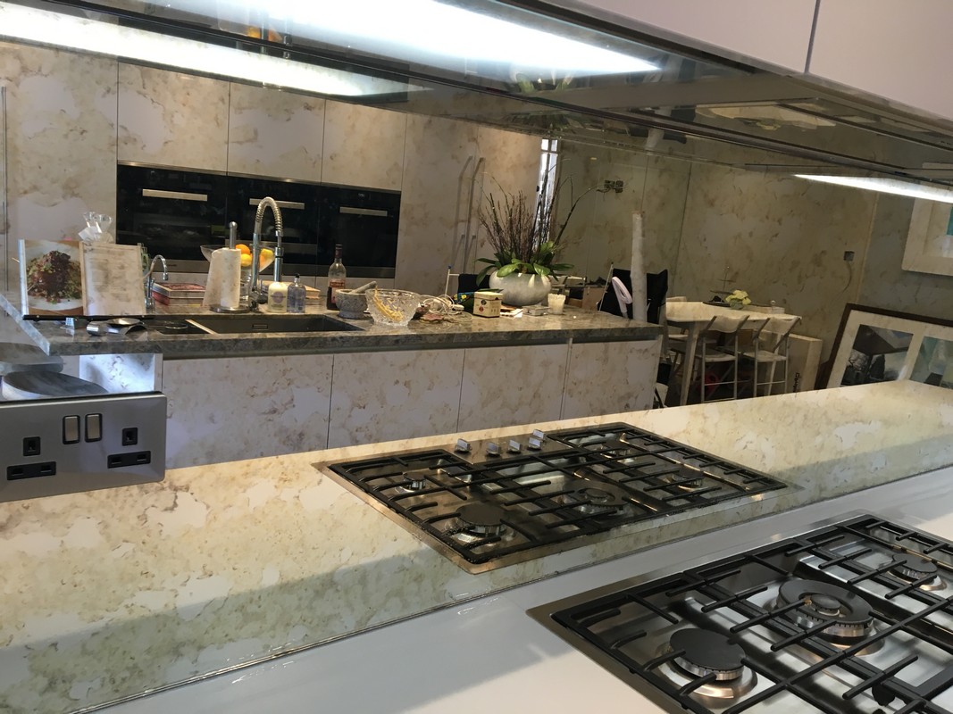 Mirror glass splashback in Forest Gate luxury kitchen